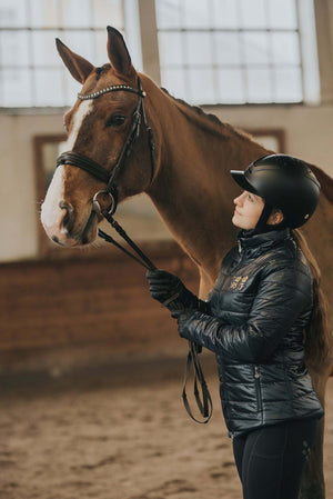 Hybrid Helmet 1.0 lightweight riding helmet with MIPS system, magnetic buckle, adjustable ventilation and fit, and module system for attachments.