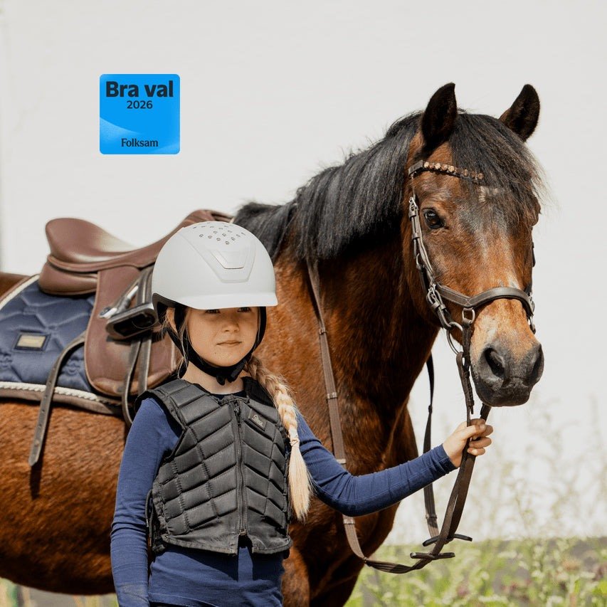 Grey junior riding helmet with adjustable liners for growing children, featuring breathable and moisture-wicking fabric